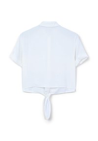 Blusa bianca a maniche corte con colletto, caratterizzata da un dettaglio annodato sull'orlo posteriore. Realizzata in un tessuto leggero e leggermente strutturato.