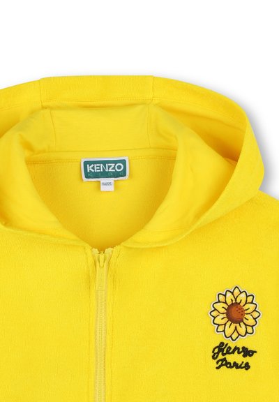 Geel rits hoodie van zacht materiaal met een geborduurd zonnebloemontwerp en de tekst "Kenzo Paris" op de borst.