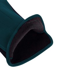 Türkiser Lederhandschuh mit einem weichen schwarzen Innenfutter, das eine gestickte Naht entlang der Außenseite aufweist. Die Oberflächen sind glatt.