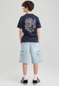 America Today Farkkushortsit - bleached denim