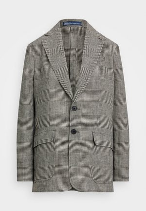 Checked blazer in black and white, featuring a notched lapel, two buttons, and two front pockets. Made of textured fabric.