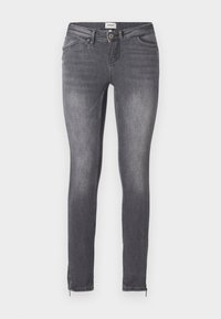 Jean slim gris en denim avec poches avant, fermeture à boutons et fermetures éclair aux chevilles présenté sur fond blanc.