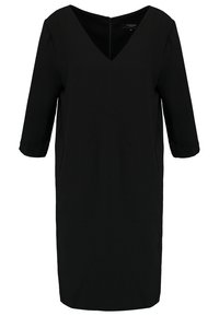 Svart klänning med trekvartslånga ärmar, V-ringning och dragkedja bak. Tillverkad av ett slätt tyg med en enkel, figurnära design.