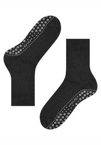 Czarne skarpety z wzorem kropek z silikonowym uchwytem na podeszwie, wykonane z gładkiego, elastycznego materiału z wzmocnionym palcem i piętą.