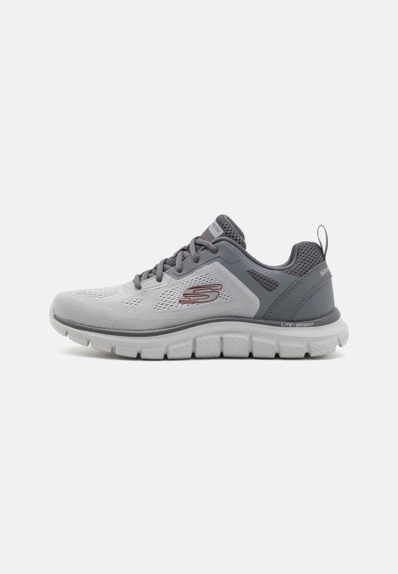 Lightweight gray athletic shoe with a breathable mesh upper, textured accents, and a cushioned white sole; features a logo on the side.