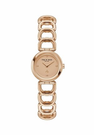 Ceas de mână din aur roz cu față rotundă, cadran minimal și brățară mare cu zale legate de rag & bone, fără cifre pe cadran.