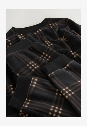 Juodas polarinis megztinis su ruda ir beige languota struktūra, su briaunotais rankovėmis ir apykakle. Minkšta tekstūra su sluoksniuota išvaizda.