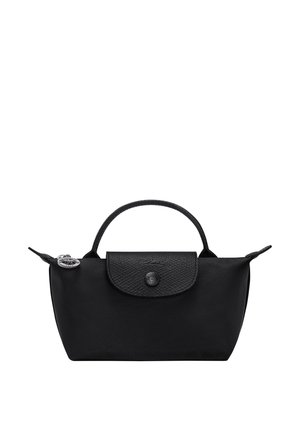 Black nylon handbag with textured flap, single top handle, zipper closure, and silver round keychain charm on the side.