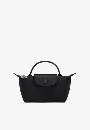Black nylon handbag with textured flap, single top handle, zipper closure, and silver round keychain charm on the side.