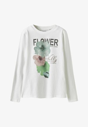 Langärmliges, weißes T-Shirt mit floralem Druck in Grün und Pink, versehen mit dem Text "BLUME DES TALS" und dekorativen Akzenten.