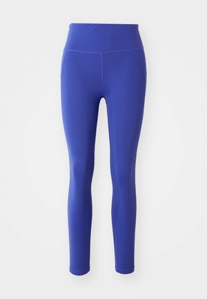 Leggings pour femmes taille haute et pleine longueur de couleur bleu vif, avec des détails de couture visibles sur un fond blanc.