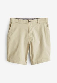 Pantalones cortos de algodón beige con cierre de botón, dos bolsillos laterales y un dobladillo limpio. El interior presenta un forro de patrón sutil.