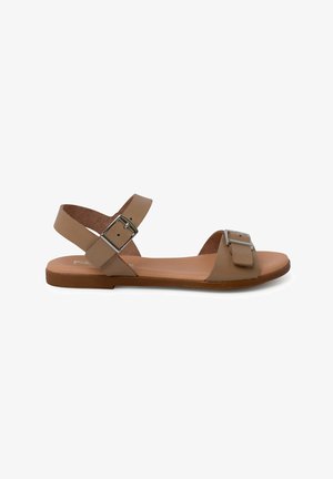 Tan leather sandal with two wide straps, featuring a silver metal buckle detail, flat sole, and minimalist design.