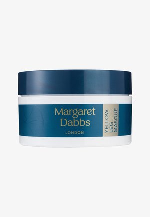 Weißes Gefäß mit dunkelblauem Deckel, beschriftet mit "Margaret Dabbs London Yellow Leg Masque" für die Beinpflege.