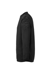 Schwarze Jacke aus glattem Material mit strukturiertem Muster auf den Schultern, Reißverschlusstaschen und modernem Schnitt.
