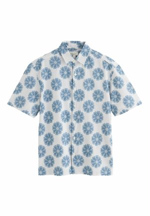 White short-sleeve button-up shirt with blue floral patterns evenly spaced across the fabric, featuring a collar and vertical subtle stripes.
