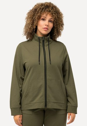 Olive green zip-up jacket with a high collar, black zipper, and adjustable drawstring. Features two front pockets and ribbed cuffs.