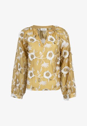 Blouse jaune avec broderie florale blanche et dorée, manches longues bouffantes et encolure ronde avec une fente en forme de V.