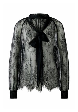 Black lace blouse with long sleeves, sheer texture, bow tie closure at the neck, and scalloped hemline. Features floral lace pattern throughout.