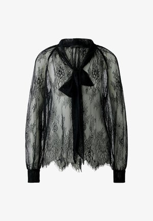 Zwarte kanten blouse met lange mouwen, doorschijnende textuur, striksluiting bij de hals en geschulpte zoom. Heeft een bloemenkant motief door het geheel.