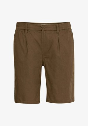 Brūni šorti, kas izgatavoti no viegla auduma, ar pogu aizdari, krokām jostasvietā un brīvu piegulšanu. Īss iekšējais šuvums, gluda tekstūra.