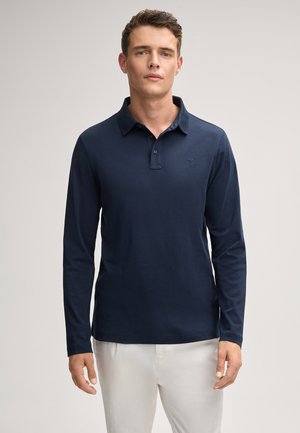 Navy-blaues Langarm-Polohemd aus weichem Stoff, mit klassischem Kragen und subtiler Logo-Stickerei auf der Brust.