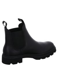 Botte Chelsea en cuir noir avec panneaux latéraux élastiques, bout rond, semelle robuste et languettes pour un enfilage facile. Surface texturée.