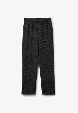 Pantaloni a quadri grigi con vestibilità ampia, dotati di un cinturino elastico e di un mix di motivi a rete rossi e blu su tutta la stoffa.