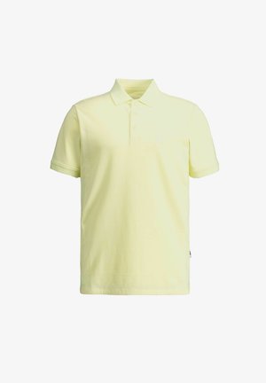 Svijetložuta polo majica kratkih rukava s trostrukim kopčanjem i klasičnim ovratnikom, prikazana na bijeloj pozadini.