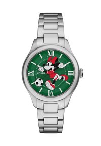 Silverfärgad klocka i rostfritt stål med en grön rund urtavla som har en fotbollsspelande karaktär, vita timmarkörer och röda accenter.