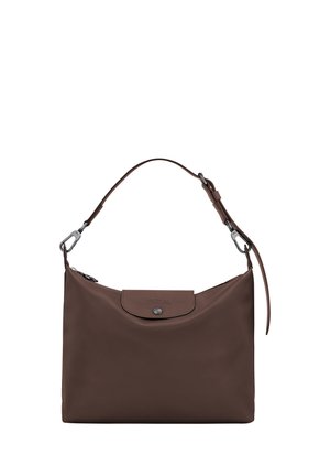 Brown leather shoulder bag with a top flap and silver button closure, featuring an adjustable strap with metal clasps.