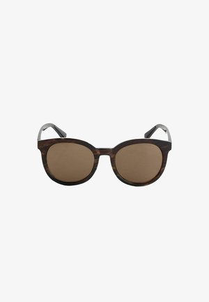 Lunettes de soleil rondes marron écaille avec des verres foncés et des branches légèrement courbées, présentées sur fond blanc uni.