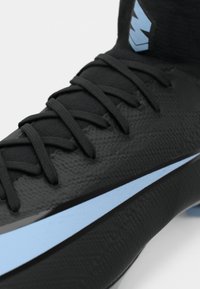 Black textured football boot with light blue Nike swoosh and black laces, featuring a high ankle sock design.