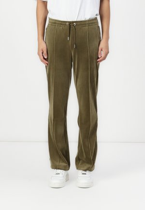 Olive green, velvety tracksuit pants with an elastic waistband, drawstring closure, side pockets, and contrasting seam details.