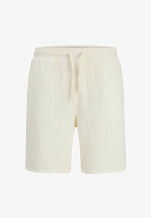 Kratasy z krémovo-bielej textúrovanej látky s elastickým pásom a šnúrkou vpredu uprostred, dĺžka po kolená, ležérny štýl.