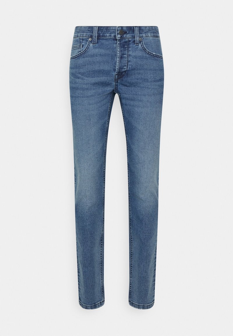 Denimjeans i medelblått, med en klassisk passform, fem fickor, bältesöljor och subtila blekningar. Tyget har en slät textur.