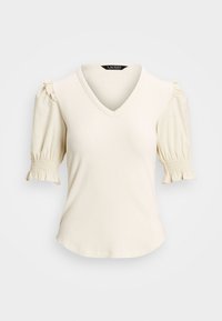 Top curto de manga curta na cor creme com decote em V, textura canelada e mangas bufantes com detalhes de franzido nos punhos. Tecido liso e leve.