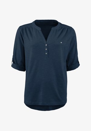 Marineblaue, leichte Hemd mit Henley-Kragen, vier Knöpfen und einer Brusttasche. Mit hochgerollten Ärmeln und einem abgerundeten Saum.