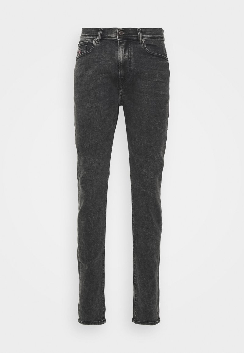 Mörk denimjeans med slim fit, med knappstängning, standardfickor och en subtil blekt struktur.