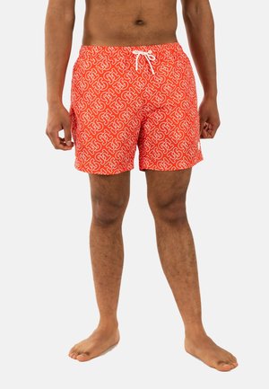 Un maillot de bain orange avec un motif géométrique blanc continu, une taille élastique avec cordon de serrage, une longueur au-dessus du genou et une texture lisse.