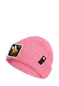 Pink knitted beanie with a textured pattern, featuring a square black patch with a bee graphic and "BUSY" text. Small black logo tag on the side.