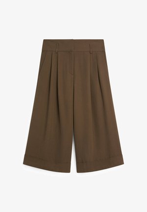 Hnědé široké kalhoty se záhyby, poutky na opasek, bočními kapsami a ohrnutými lemy.