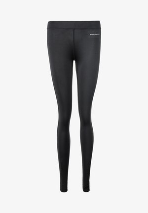 Zwarte legging van rekbare stof met een gladde textuur. Voorzien van een hoge tailleband en subtiele branding vlakbij de taille.