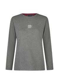 Grijs shirt met lange mouwen van zachte stof, ronde halslijn, met "holly JOLLY" in witte borduursels. De binnenkant van de kraag heeft een rood-groen ruitpatroon.