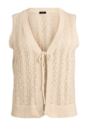 Flødefarvet strikket ærmeløs vest med kabel- og blondermønstre, åben foran og bundet med en lille sløjfe.