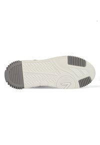 Witte rubberen zool van een schoen met grijze accenten, voorzien van een gestructureerd patroon en zigzagloopvlak voor grip, inclusief een cirkelvormig detail nabij de teen.