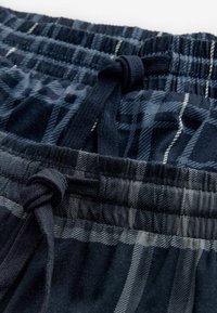 Shortsit elastic-waihtband di tumis sinihto tummas de multim tjumme; mel'idathod iora thirinchr olatib Proposition Wbo lailibat.