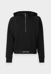 Čierny skrátený hoodie s dlhými rukávmi, vysokým golierom a predným polozipsom. Má logo pás na páse. Vyrobený z mäkkej tkaniny.