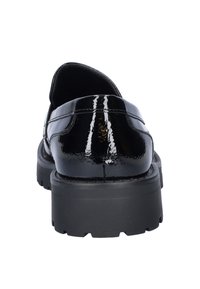 Black patent leather loafers with a chunky rubber sole and raised stitching details. The heel is low and broad for added stability.