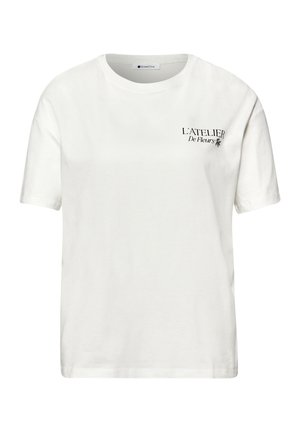 White short-sleeve T-shirt with round neck and small black text "L'ATELIER De Fleurs" on the upper left chest.